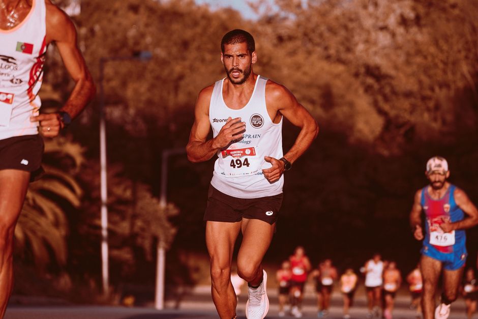 Marathon runners competing outdoors, showcasing determination and athleticism. Ideal for fitness and sports themes.