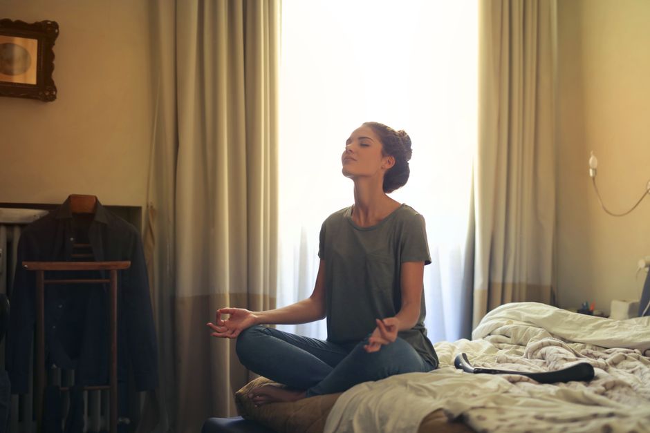 Woman taking a quiet moment to breathe and reset